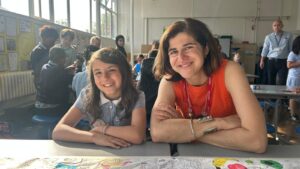 Sarah and a child at the free breakfast club at Claremont Primary School